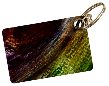 Bunte Schlüsselanhänger aus Kunststoff mit abstraktem Muster in verschiedenen Farben.
