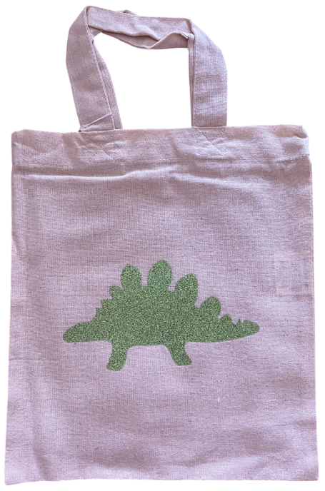 Stofftasche mit einem grünen Dinosaurier-Motiv auf lila Hintergrund.