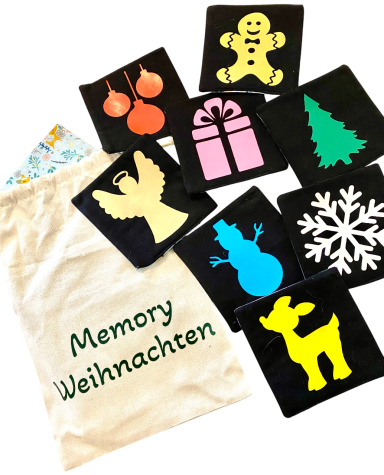 Bunte Memory-Karten mit Weihnachtsmotiven und einem Stoffbeutel mit der Aufschrift "Memory Weihnachten".
