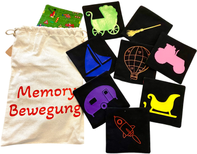 Bunte Memory-Karten mit verschiedenen Motiven und einer Tasche beschriftet "Memory Bewegung".