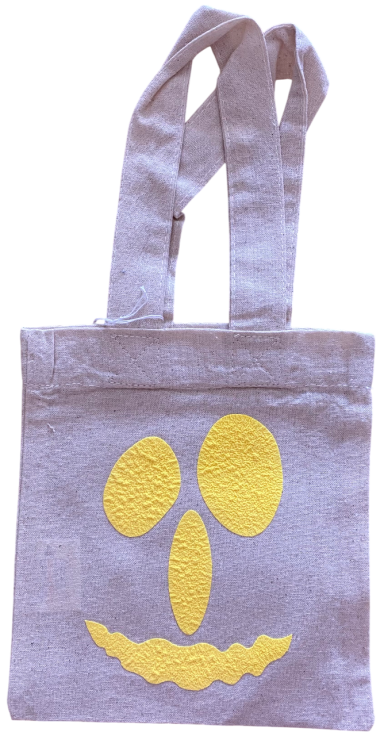 Graue Tasche mit gelbem, lächelndem Gesicht und zwei ovalen Augen.
