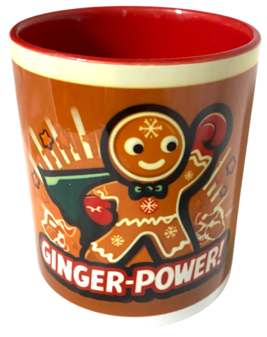 Tasse mit einem lächelnden Lebkuchenmann und dem Schriftzug "GINGER-POWER!".